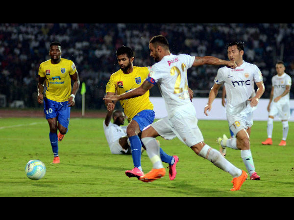 Players of Northeast United FC (in white jersey) and Kerala Blasters FC (in yellow jersey) in action during the opening match of the 3rd season of Indian Super League (ISL) 2016.