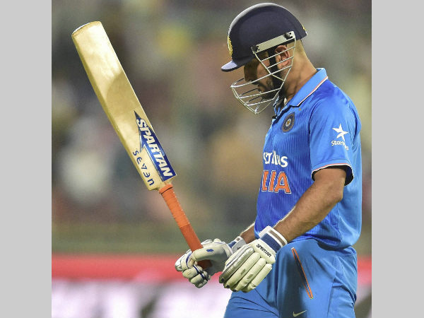 A disappointed Dhoni leaves the field after being dismissed by Tim Southee