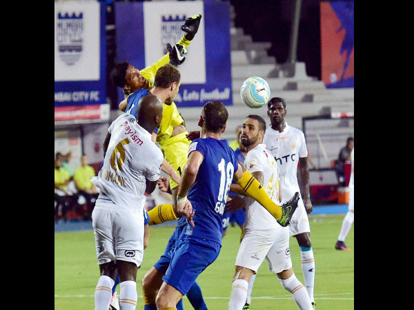 Mumbai City FC and NorthEast United FC players vie for the ball during their ISL Match in Mumbai.