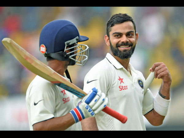 Indian batsmen Virat Kohli and Ajinkya Rahane return to the pavilion at the end of the first day's play during the third Test match against New Zealand in Indore.
