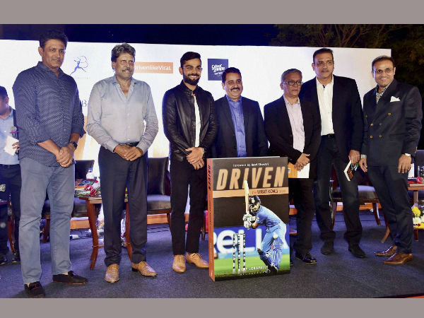  Indian Test Cricket team Captain Virat Kohli with team coach Anil Kumble, former cricketers Kapil Dev,Ravi Shastri,Virender Sehwag, his coach Rajkumar Sharma, author of the book Vijay Lokapally at the book launch of Kohli's biography 'Driven' in New Delhi on Tuesday.