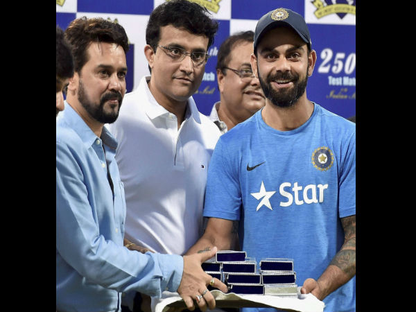 Virat Kohli receiving commemorative coins from BCCI chief Anurag Thakur Virat Kohli receiving commemorative coins from BCCI chief Anurag Thakur