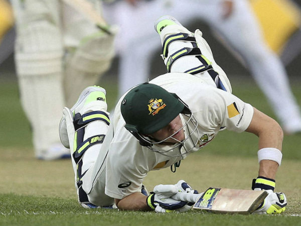 Australia's Steven Smith dives back to his crease during an attempted run out during their cricket test match against South Africa in Hobart.