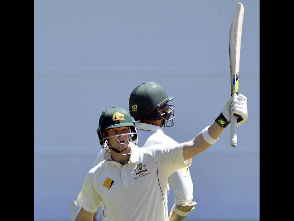 Australian captain Steven Smith raises his bat after scoring 150 runs against Pakistan on the fifth day of their second cricket test in Melbourne
