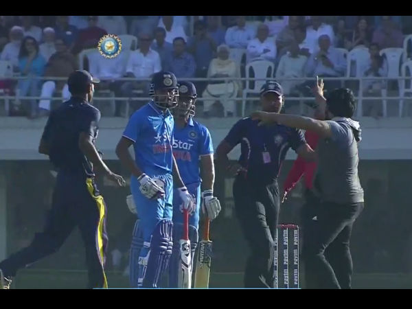 Security personnel take fan away