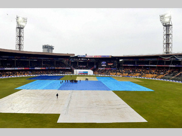 File photo: Bengaluru's M Chinnaswamy Stadium's most part of the ground is under covers after rain. With the latest drainage system, stoppage of play due to rain will be less.