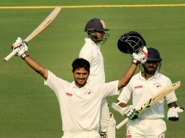Gujarat batsman Priyank Panchal celebrates his century as Parthiv Patel looks on during the Ranji Trophy semifinal against Jharkhand at VCA stadium in Nagpur