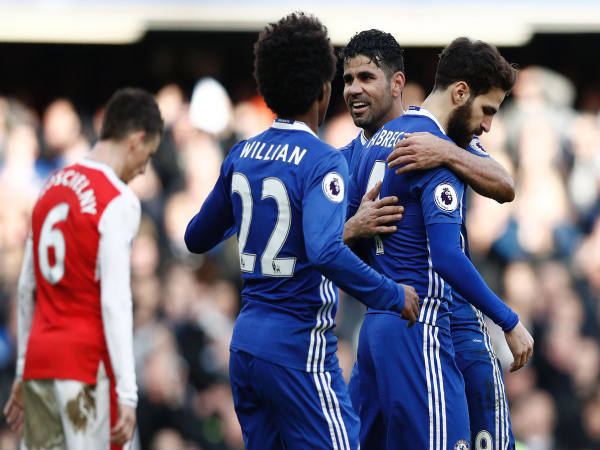 Cesc Fabregas congratulated by teammates