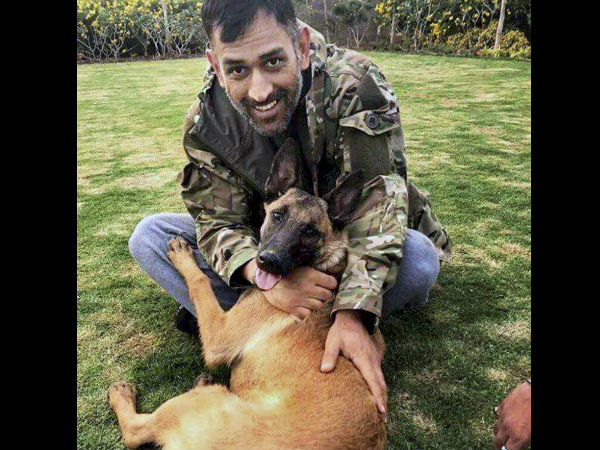 Dhoni spends time with his dog at his residence