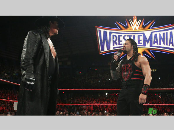 The Undertaker (left) & Roman Reigns (image courtesy WWE.com) The Undertaker (left) & Roman Reigns (image courtesy WWE.com)