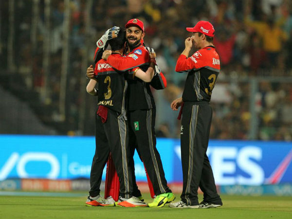 Yuzvendra Chahal celebrates with Virat Kohli after getting a wicket against KKR. Image Courtesy: BCCI