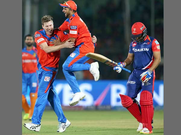 Suresh Raina (centre) celebrates with James Faulkner