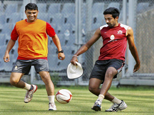 Pravin Tambe (left)