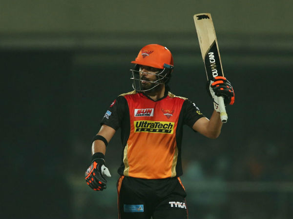 Yuvraj Singh lifts bat after hitting a fifty against Delhi. Image Courtesy: BCCI