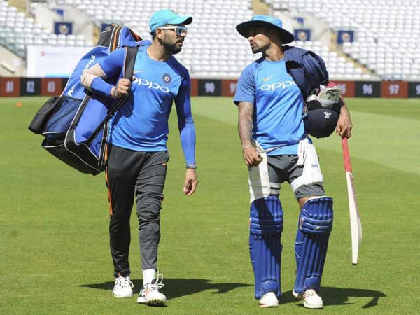 Yuvraj Singh (left) and Shikhar Dhawan