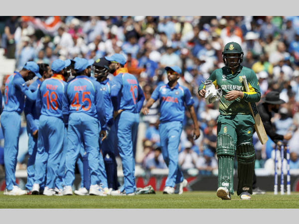 Indians (left) celebrate the dismissal of Quinton de Kock (right)