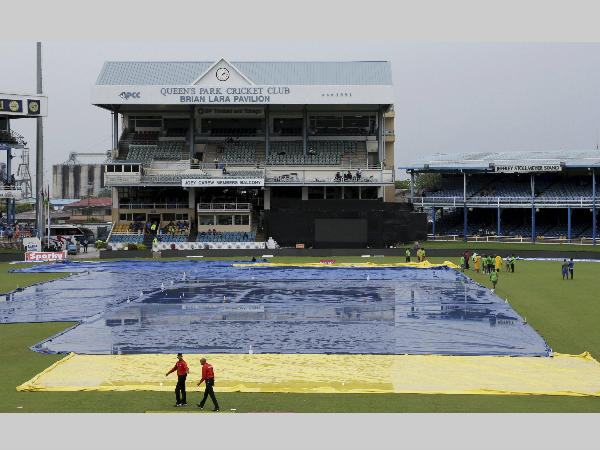 Queen's Park Oval ground is under covers after rain in the 1st ODI between India and West Indies Queen's Park Oval ground is under covers after rain in the 1st ODI between India and West Indies