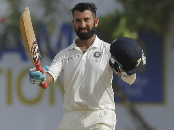 Pujara celebrates his century against Sri Lanka in Galle Pujara celebrates his century against Sri Lanka in Galle