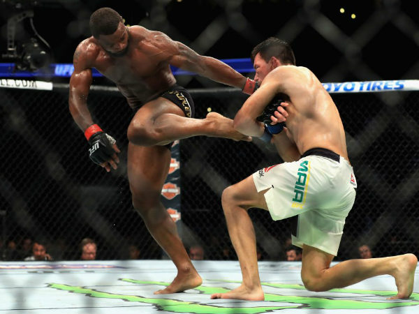 Tyron Woodley (black trunks) defends a takedown