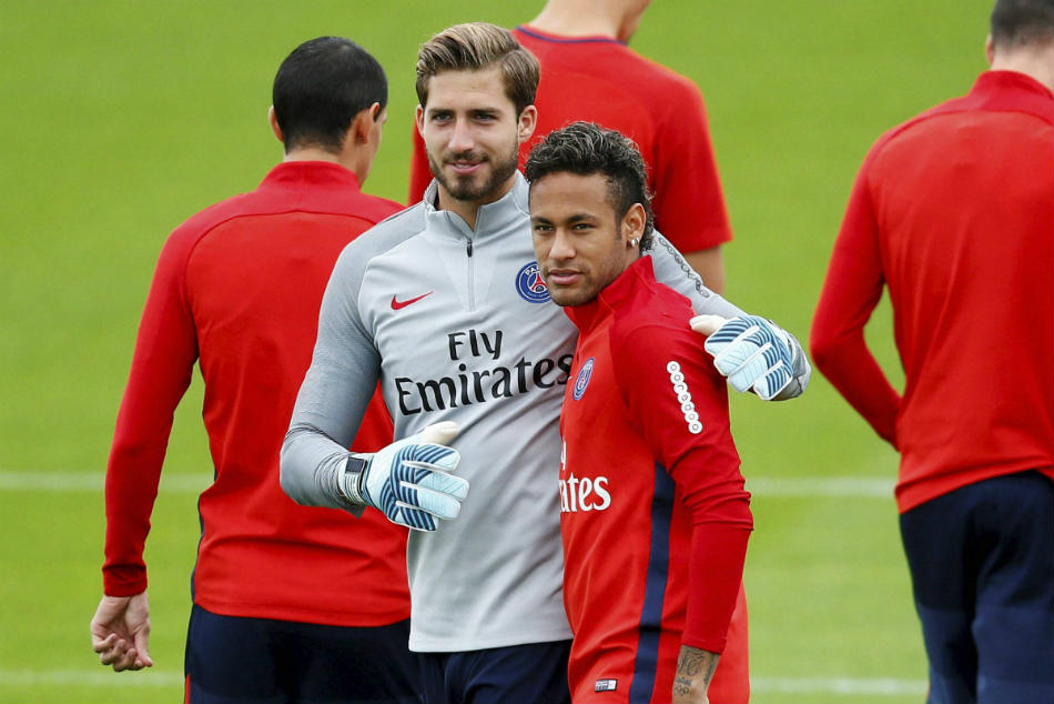 PSG's Neymar, right, talks with PSG goalkeeper Kevin Trapp during a training session PSG's Neymar, right, talks with PSG goalkeeper Kevin Trapp during a training session