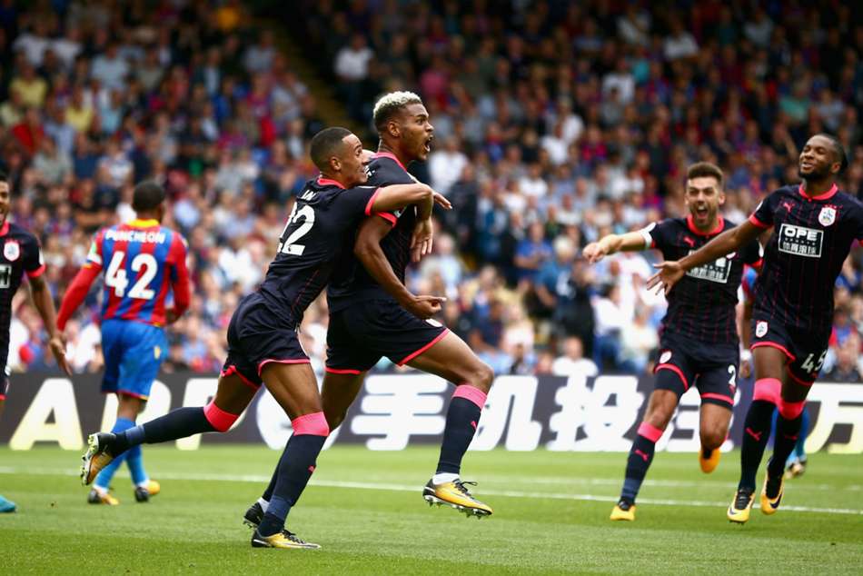 Huddersfield Town striker Steve Mounie celebrates his brace against Crystal Palace in the Terriers stunning victory Huddersfield Town striker Steve Mounie celebrates his brace against Crystal Palace in the Terriers stunning victory