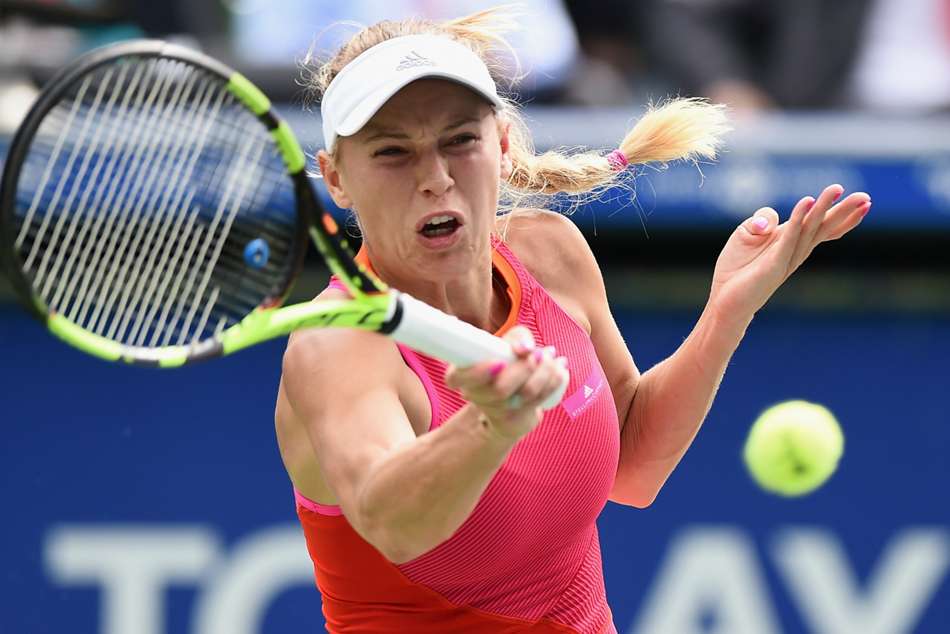 Caroline Wozniacki in action against Anastasia Pavlyuchenkova at Tokyo Open Caroline Wozniacki in action against Anastasia Pavlyuchenkova at Tokyo Open