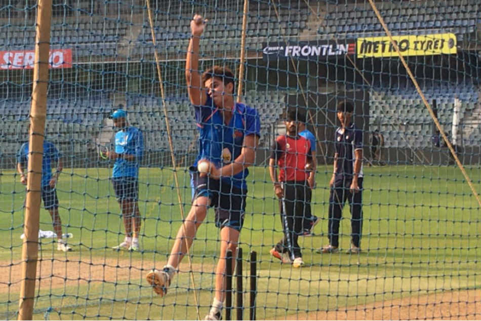 Arjun Tendulkar, the son of cricket legend Sachin Tendulkar, bowls to India players at the nets