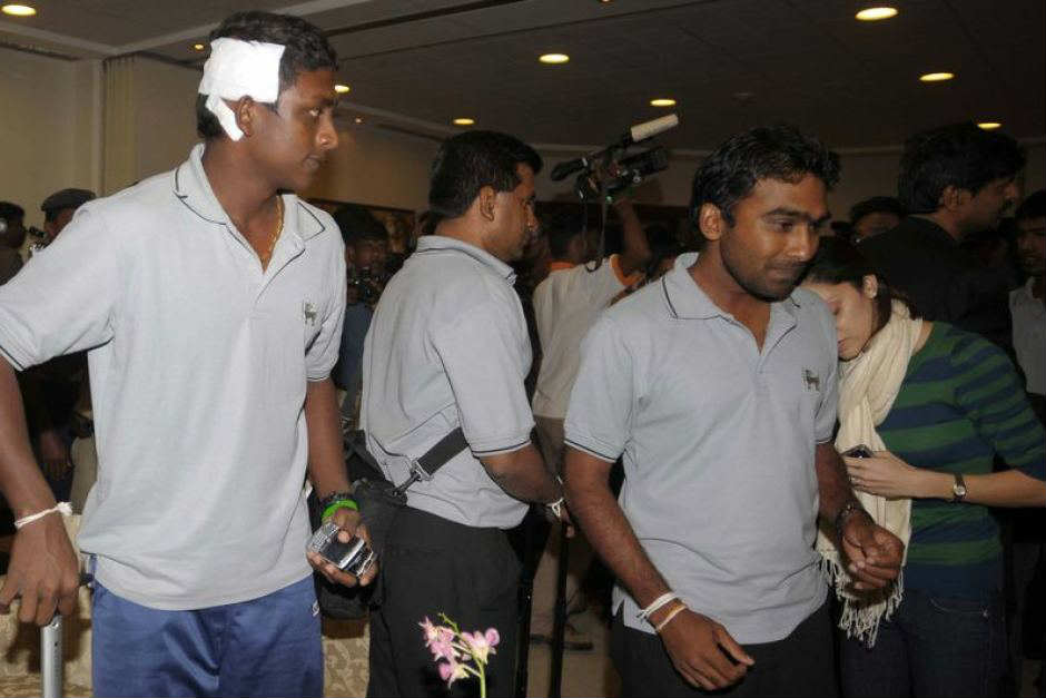 Sri Lanka players Ajantha Mendis and Mahela Jayawardene after the team bus shooting in 2009