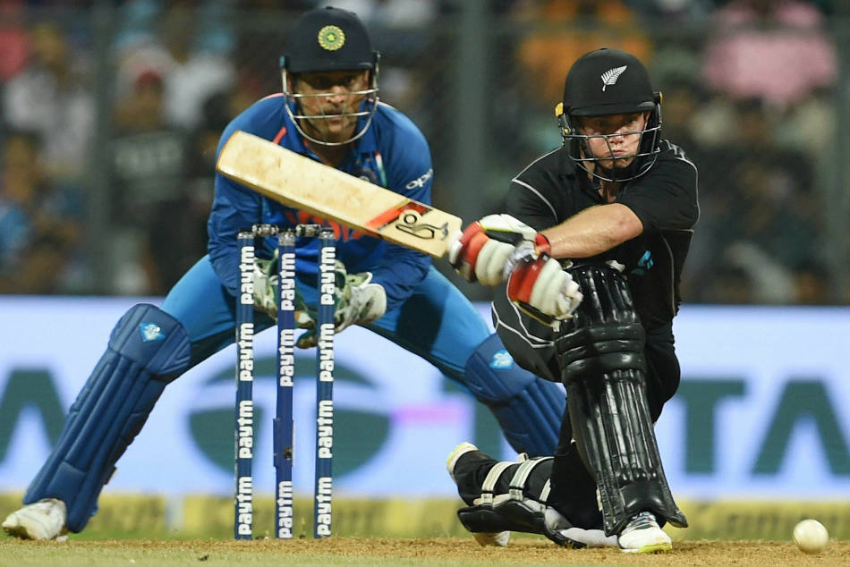 Tom Latham of New Zealand plays a reverse-sweep en route to his unbeaten 103 against India in Mumbai on Sunday
