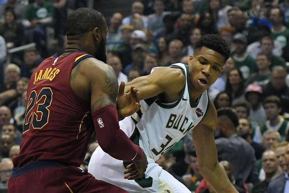 LeBron James vies with Giannis Antetokounmpo LeBron James vies with Giannis Antetokounmpo