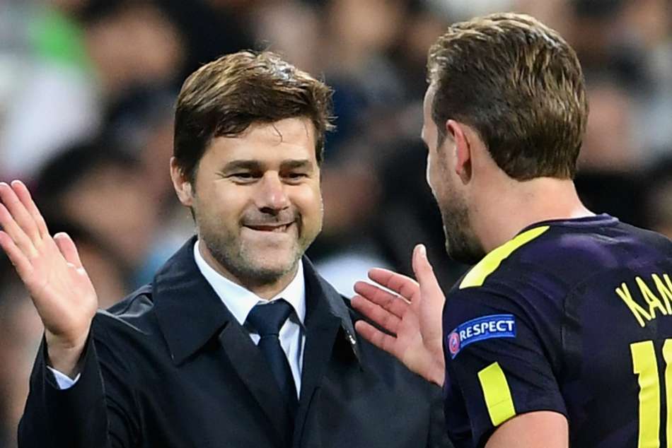 Pochettino and Kane celebrate after 1-1 draw against Real Madrid away from home in Champions League Pochettino and Kane celebrate after 1-1 draw against Real Madrid away from home in Champions League