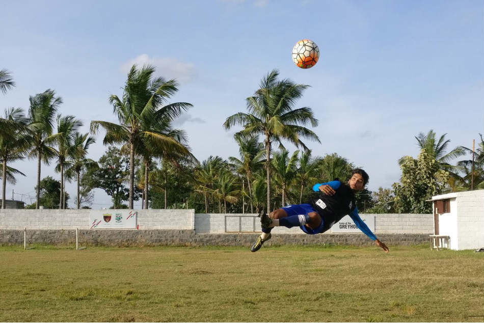 Avishek Singh of Rebels FC Football Academy attempts an overhead kick at their training ground in Kommaghatta, off Kengeri, in Bengaluru