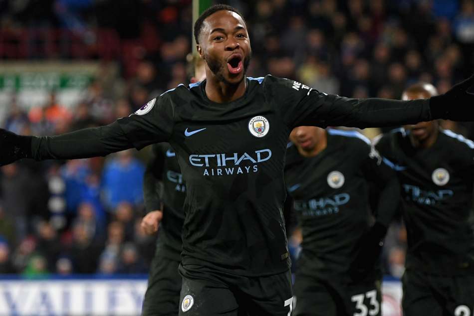 Manchester City's Raheem Sterling celebrates after scoring the winner against Huddersfield Town Manchester City's Raheem Sterling celebrates after scoring the winner against Huddersfield Town