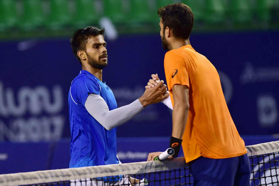 Sumit Nagal (left) meets Yuki Bhambri at the net after his semi-final win at the Bengaluru Open ATP Challenger