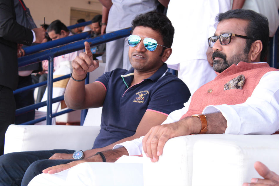 Sandalwood actor Puneeth Rajkumar (left) with Karnataka State Football Association president NA Haris during the match