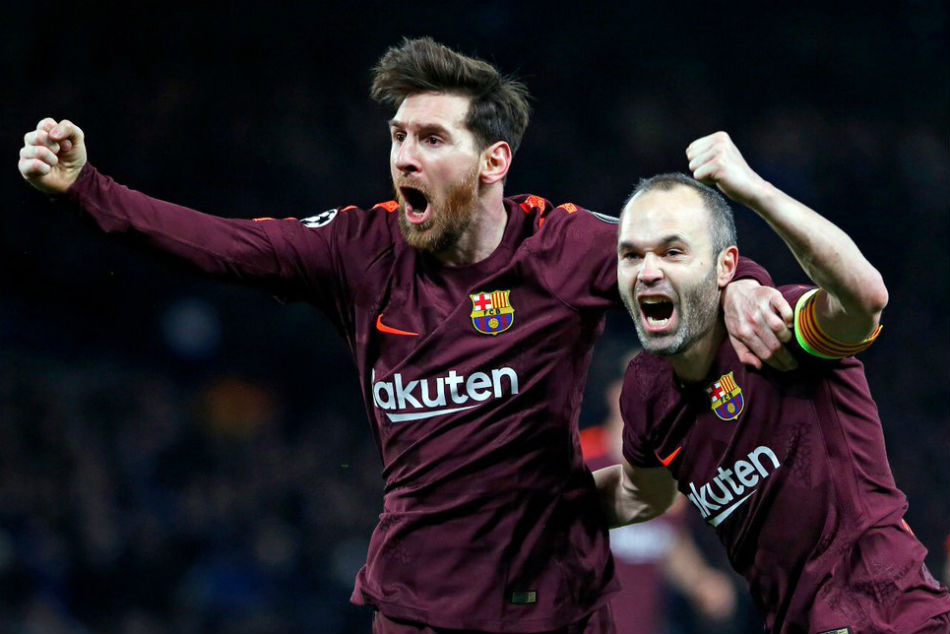 Andres Iniesta, right, celebrates with Lionel Messi after helping the latter score. Image: Twitter
