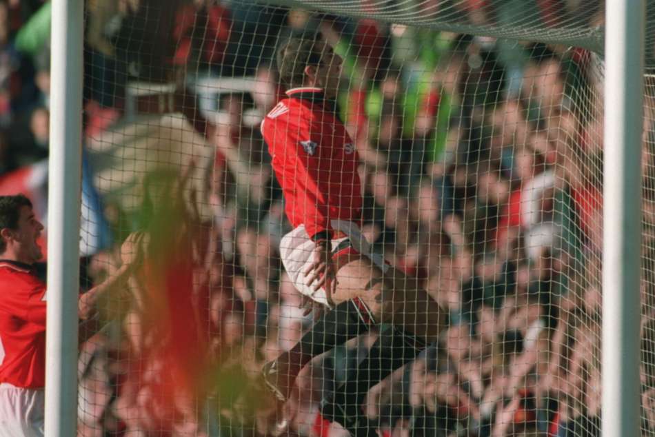 Manchester United's Eric Cantona celebrates after scoring against Liverpool Manchester United's Eric Cantona celebrates after scoring against Liverpool