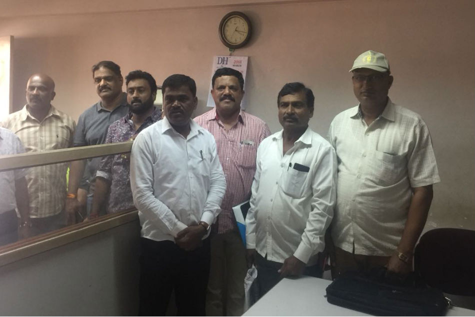 Rebel officials pose at the empty Karnataka Amateur Athletics Association office at the Sree Kanteerava Stadium