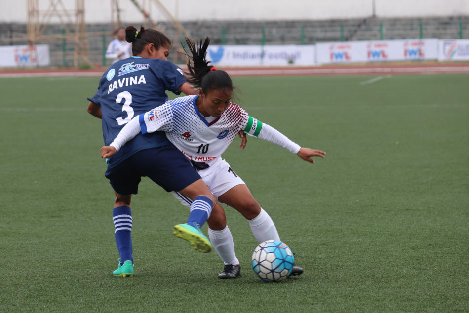 Prameshwori Devi of Eastern Sporting Union shielding a challenge by Ravina Yadav of India Rush Soccer Club during their Indian Womens League match in Shillong on Saturday (Image: AIFF Media)