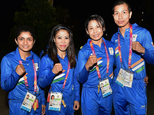 Indian boxing contingent (from left) Pinki Rani Jangra, Mary Kom, Sarita Devi Laishram and Lovlina Borgohain during the countrys flag-hoisting ceremony of the Commonwealth Games 2018 at Gold Coast on Monday. 