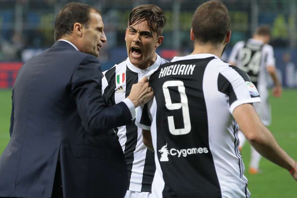 Juventus head coach Massimiliano Allegri (left) celebrates with match winner Gonzalo Higuain Juventus head coach Massimiliano Allegri (left) celebrates with match winner Gonzalo Higuain