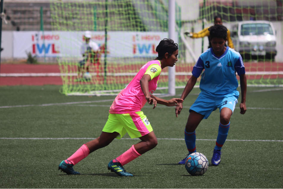 Sabina Khatun (left) of Sethu FC attempts to dribble past Jabamani Tudu of Rising Students Club during their Indian Womens League match in Shillong on Monday (Image: AIFF Media)