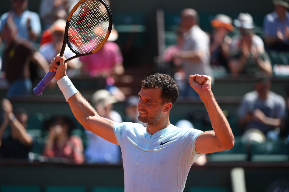 Grigor Dimitrov of Bulgaria is relieved after beating Jared Donaldson during their second-round match