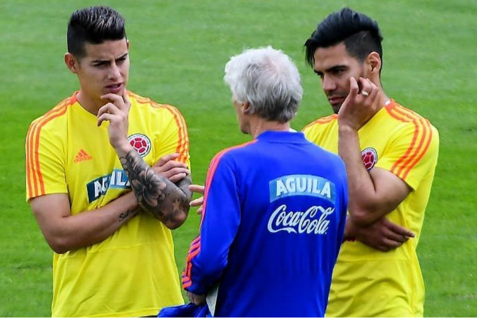 James Rodriguez (left) of Colombia with teammate Radamel Falcao (right) and coach Jose Pekerman during a training session for the FIFA World Cup (Image: Twitter)