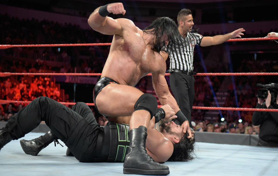Drew McIntyre (up) punches Roman Reigns (image courtesy WWE.com) Drew McIntyre (up) punches Roman Reigns (image courtesy WWE.com)
