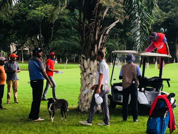 Udayan Mane tries to retrieve his golf ball which got caught in the tree. Credit: Chitrangada