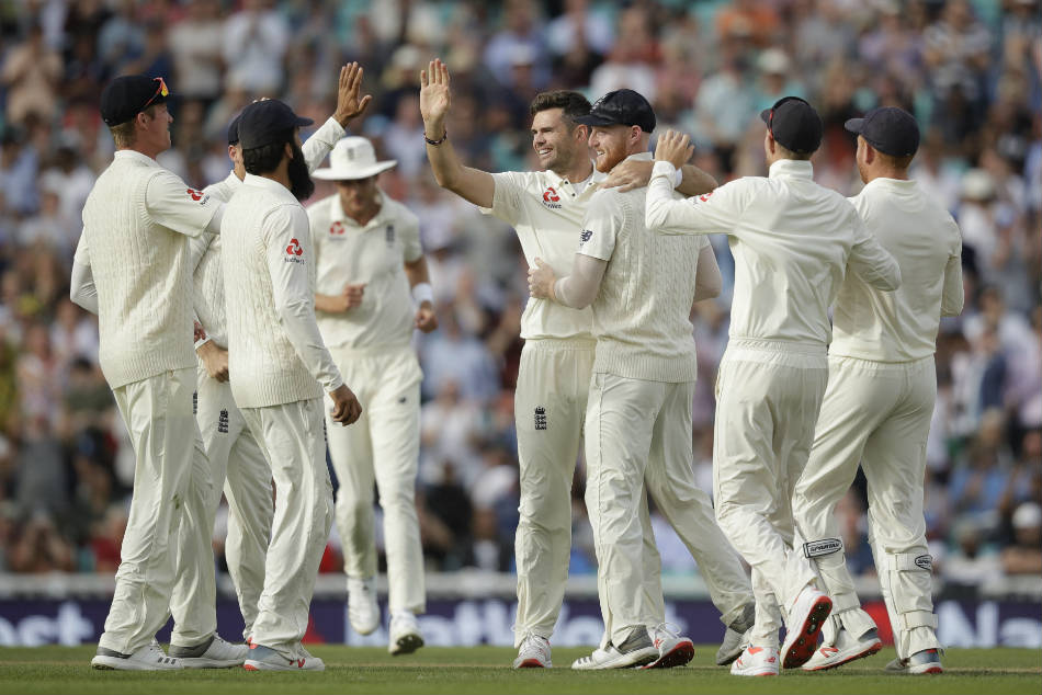 England players celebrate a wicket against India