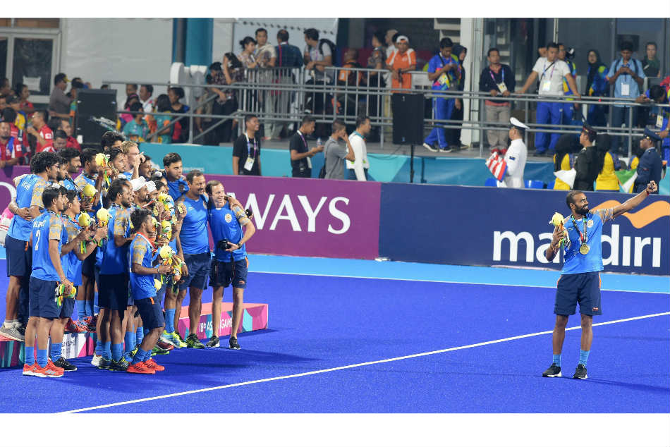 India hockey captain PR Sreejesh clicks a selfie along with his team after they won a bronze at the Asian Games 2018