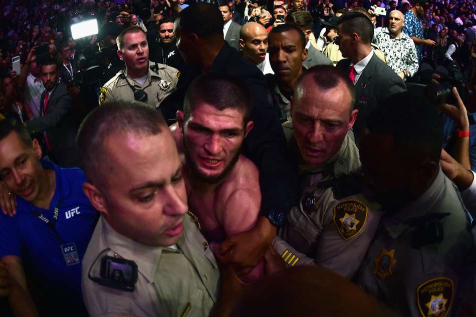 Khabib escorted out after melee Khabib escorted out after melee