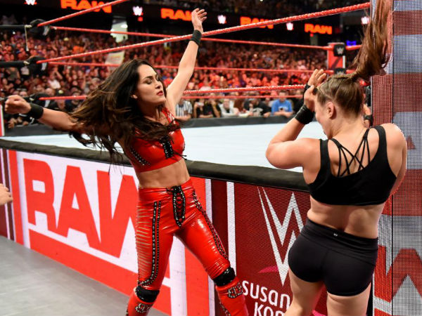 Can Ronda Rousey ward off The Bella Twins alone?